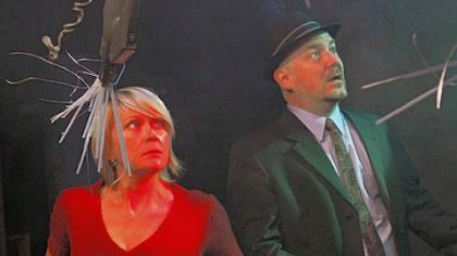 Tami Dixon and Jeffrey Carpenter, heads of Bricolage theater, anticipate a Martian attack in "War of the Worlds."