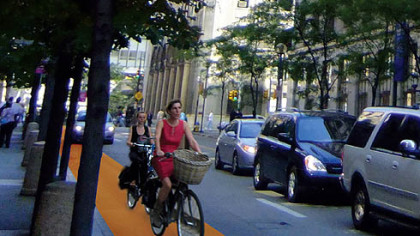 Implementing new bike paths simply
requires a bright coat of orange paint, which greatly  increases biker presence on the road