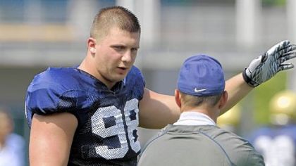 Chas Alecxih, left, tries to clarify a point during practice Wednesday at Pitt's South Side facility.