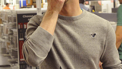 Chef David Racicot, contemplates tables and chairs as he tours Ikea.