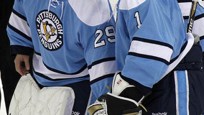 Penguins goaltender Brent Johnson, right, celebrates with Marc-Andre Fleury.