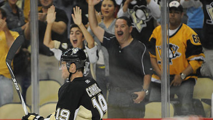 Penguins forward Mike Comrie celebrates a goal in the first period.