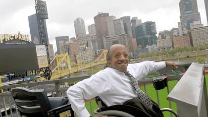 Chaz Kellem, who works in community affairs for the Pittsburgh Pirates, poses at PNC Park.