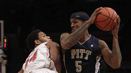 Pitt's Gilbert Brown protects the ball from Maryland's Sean Mosley in the first half of Thursday's game at Madison Square Garden in New York.
