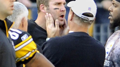 Steelers quarterback Ben Roethlisberger has his jaw examined on the sideline after Raiders defensive lineman Richard Seymour punched him in the second quarter of Sunday's game at Heinz Field.