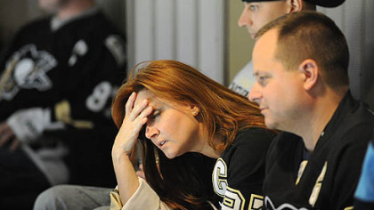 Melissa Deberry of Uniontown holds her head in the third period.