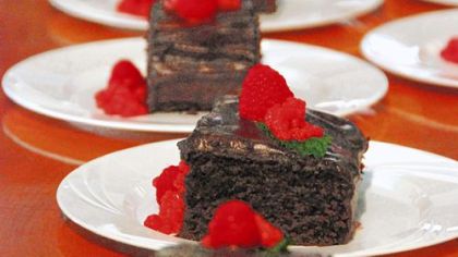 Vegan Chocolate Cake used no eggs or dairy products; the chocolate mint chantilly frosting is whipped chocolate and water with lecithin. The cake is garnished with agar-thickened raspberry "pearls."