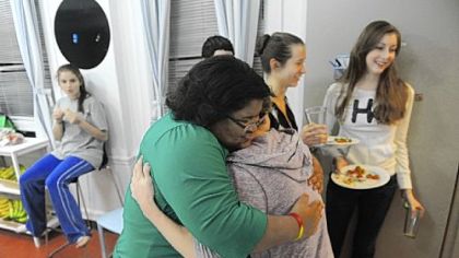 Cameron Clark hugs Marchae Peters, the dorm supervisor, at the Pittsburgh Ballet Theatre's Byham House for out-of-town students.