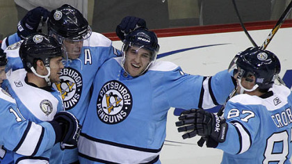 Penguins defenseman Alex Goligoski, center, refers to his new position at "Rover."