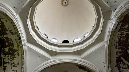 The cupola is missing stained-glass windows.