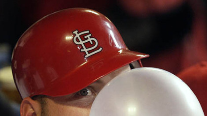 The Cardinals' Matt Holliday blows a bubble in the dugout in the bottom of the seventh inning.