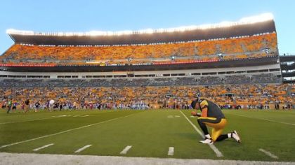 Steelers quarterback Ben Roethlisberger takes a knee and prays before the start of last week's game against the Carolina Panthers at Heinz Field.