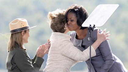 First Lady Michelle Obama and former First Lady Laura Bush embrace during the Flight 93 National Memorial ceremony in Shanksville today.