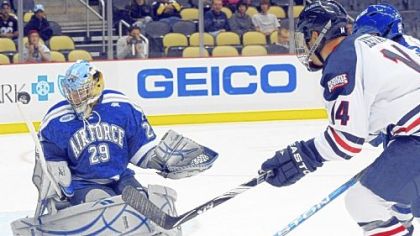 Zach Hervato follows up on a shot ricocheted off Air Force goalie Jason Torf in Sunday's game at Consol Energy Center.