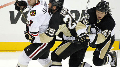 Penguins forward Arron Asham collides with teammate Max Talbot behind Blackhawks defenseman Brent Seabrook in the first period.