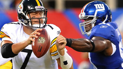Ben Roethlisberger tries to avoid New York's Justin Tuck. In his first action of the preseason, Roethlisberger completed 6 of 8 passes for 76 yards and one interception.