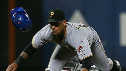 Pirates shortstop Ronny Cedeno goes over the top of the Met's Ruben Tejada after Tejada was called out during the eigth inning.