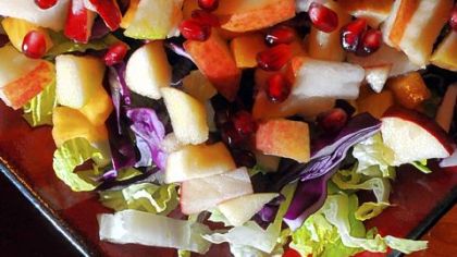 Chopped Autumn Salad with persimmons and pomegranates.