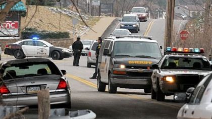 Police investigate the scene on Beatty Road in Monroeville where a 10-mile chase ended on Friday.