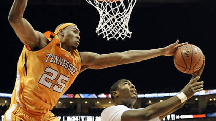 Tennessee's John Fields blocks a shot by Pitt's Ashton Gibbs in the first half at Consol Energy Center Saturday.