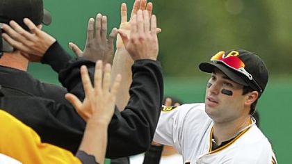 Neil Walker celebrates with teammates after the Pirates beat the Astros, 9-3, Sunday in the season finale at PNC Park.