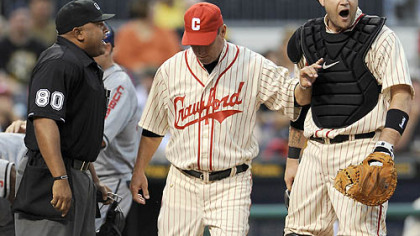 An angry Snyder then has to be separated from umpire Adrian Johnson by manager John Russell.