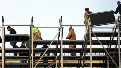Workers erect temporary stands on Tuesday in the south end of Heinz Field for the Winter Classic.