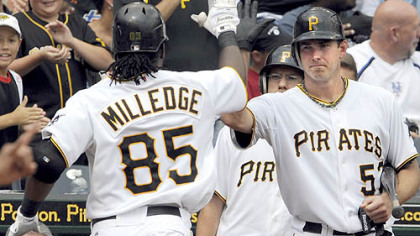 Starting pitcher Zach Duke congratulates Lastings Milledge after Milledge hit a home run against the Mets in the fifth inning Sunday at PNC Park.