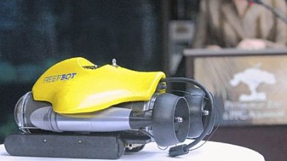 ReefBot is displayed at a media reception last week at the Pittsburgh Zoo & PPG Aquarium while Dr. Barbara Baker, zoo president and CEO.