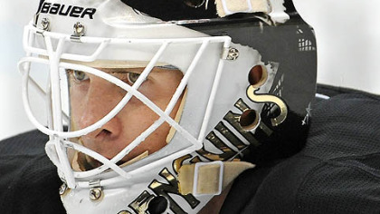 Penguins goalie Brent Johnson lines up for shot by Senators captain Daniel Alfredsson.