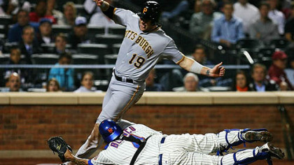 Mets catcher Henry Blanco is unable to tag the Pirates' Chris Snyder, who scored on a single hit by Andrew McCutchen in the fourth inning.