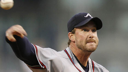 Braves starting pitcher Derek Lowe throws in the first inning.