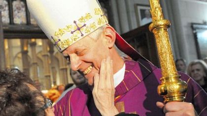Cardinal Donald Wuerl, the archbishop of Washington, D.C., greets a woman after giving a Mass of Thanksgiving at St. Paul Cathedral in Oakland on Sunday.