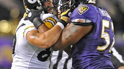 Hines Ward and Ray Lewis get tangled up in the first half.
