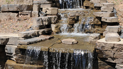 A waterfall made with Rosetta stones by OmniPro in the backyard of Janet Davis' home in Aspinwall.