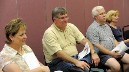 Cindy and Skip Goettman of Mars and Dan and Bonnie Goncar listen to a presentation at a meeting of the young-onset Parkinson's disease support club at the Christ Church at Grove Farm in Sewickley.