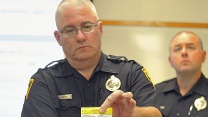 Pittsburgh police Sgt. Jeff Watt displays a new waterproof citation at Fire and Police Training Academy in East Liberty. The new tickets, which can be printed by patrol officers, are among several advances in techonlogy that were displayed Tuesday by city officials. In the background is police officer Don Adamsky.