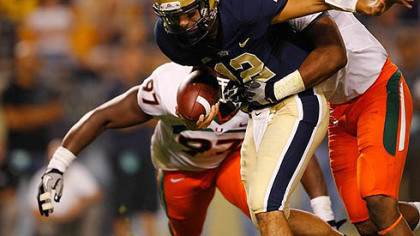 Pitt quarterback Tino Sunseri  is sacked by Andrew Smith of the Miami Hurricanes Thursday night at Heinz Field. Pitt lost 31-3.