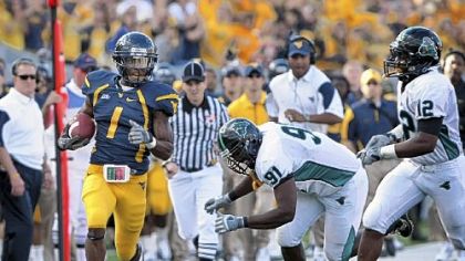 West Virginia's Tavon Austin runs down the sidelines for a first down against Coastal Carolina in the third quarter Saturday in Morgantown, W.Va.