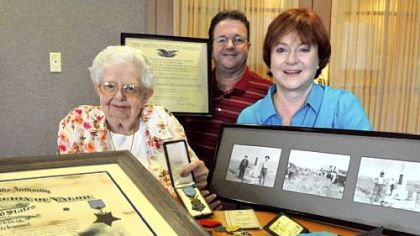 Betty Willey, left, a resident of Asbury Villas in Mt. Lebanon with her nephew Don Willey of Houston, Texas, and Melinda Willey of Sacramento, Calif., display some memorabilias of Betty's uncle John Kirkwood, including a Medal of Honor from the Congress.