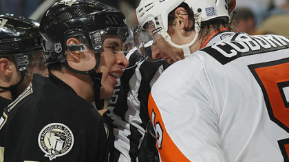 Penguins captain Sidney Crosby exchanges words with Flyers defenseman Braydon Coburn.