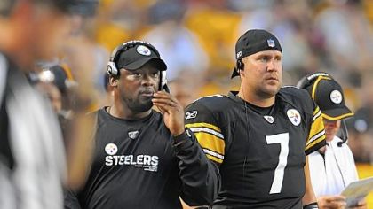 Ben Roethlisberger, right, spent the game on the sideline next to Mike Tomlin.