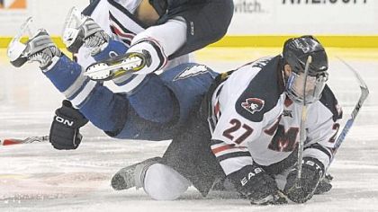 Robert Morris' Brandon Blandina, bottom, collides with Scott Mathis, center and Furman South in Robert Morris' victory Sunday against Air Force.
