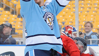 Penguins alumni Robbie Brown celebrates his goal on a pass from Mario Lemieux.