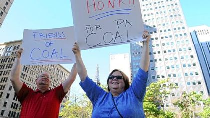 Tim and Janet Schivley of Washington, Pa., rally on Tuesday at Mellon Square in support of coal jobs. The rally was organized by the Common Sense Movement, a group of individuals and businesses committed to protecting the jobs and ensuring the vitality of the local coal and natural gas industries.