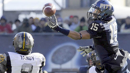 Pitt's Devin Street stretches but can't pulll down a pass in the first quarter. Defending is WVU's Keith Tandy.