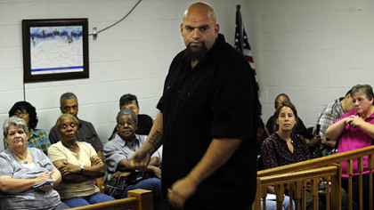 Braddock mayor John Fetterman turns away from concerned Braddock residents at an emergency council meeting over missing funds.