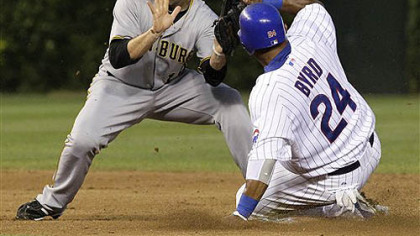 The Cubs' Marlon Byrd steals second base as Neil Walker is unable to field a throw from catcher Ryan Doumit Monday at Wrigley Field.
