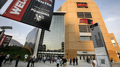 Hockey fans arrive at Consol Energy Center. It was the first hockey game to be played at the new building.