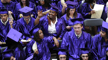 Octavia Shelly, 20, from West Mifflin High School, waves to onlookers before the graduation ceremony for the class of 2010 from Phase 4 Learning Center at the Century III Mall in West Mifflin on May 26.